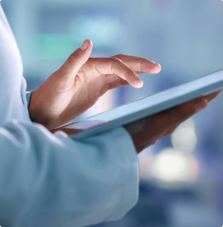 Photo of hands working with an Ipad
